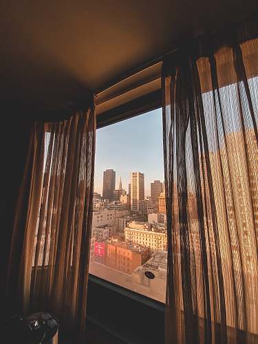 indoors cityscape through wind with curtains interior design